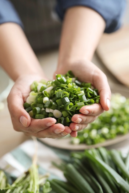 Cooking. Chef is cutting greens in the kitchen