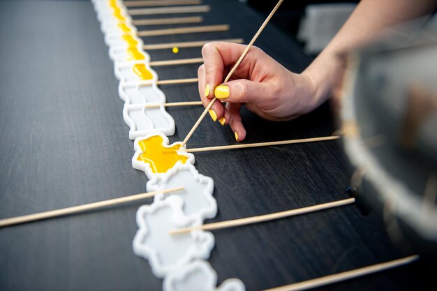 Cooking lollipops in the shape of the flag of ukraine