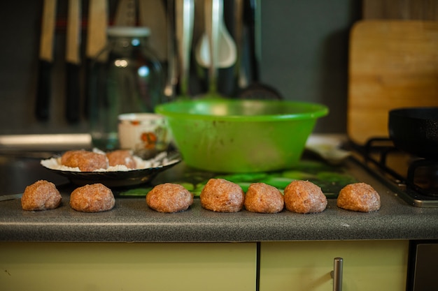 Free Photo cooking meatballs, ready mince lies by roasting on the kitchen table