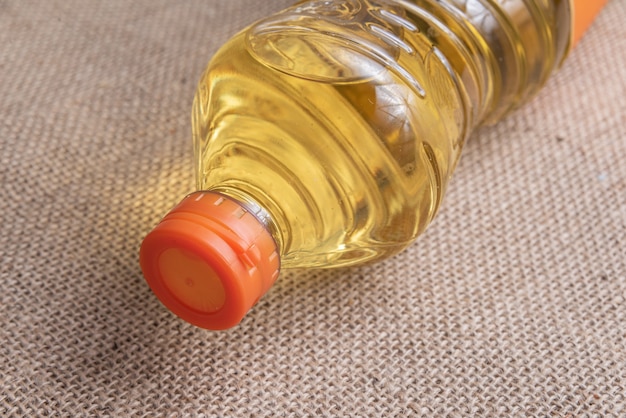 Free photo cooking oil on the brown jute background