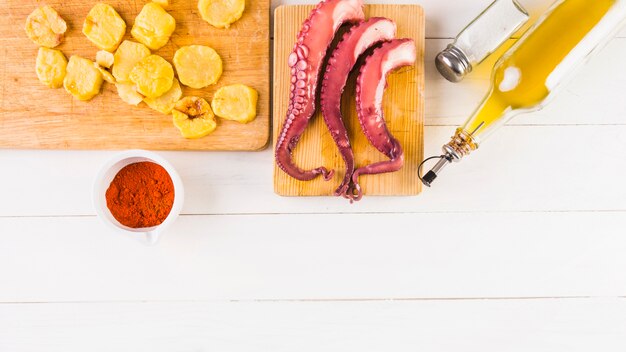 Cooking table with potatoes and octopus