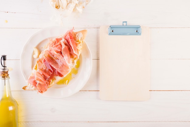 Cooking table with sandwich and clipboard