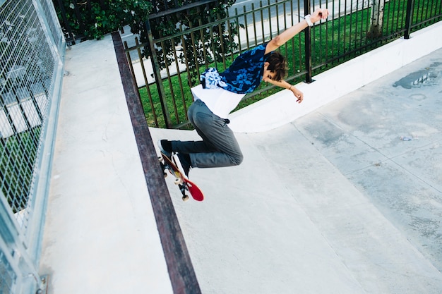 Cool skater jumping in the half pipe