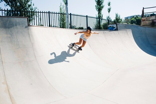 Cool woman enjoying the skatepark