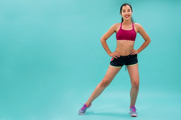 Cool woman stretching before training