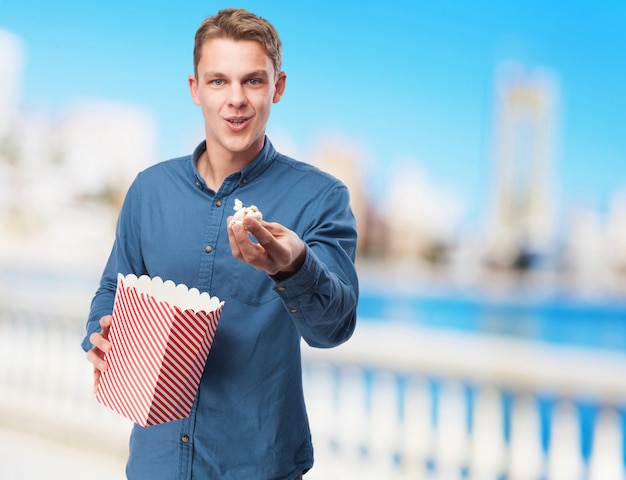 cool young-man with popcorn