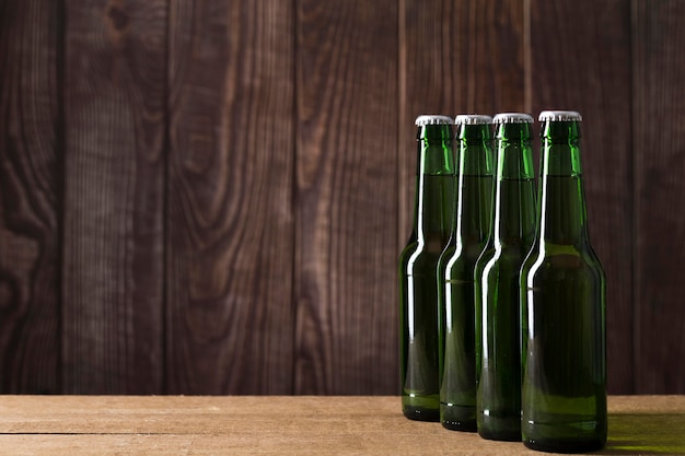 Free Photo copy-space beer bottles aligned