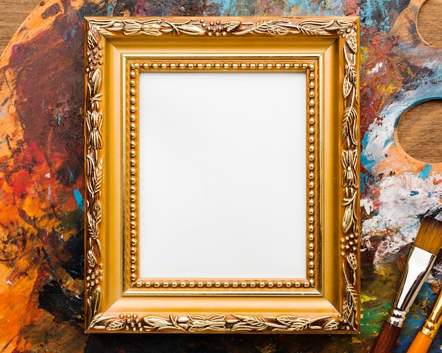 Free photo copy space canvas in golden frame and paint