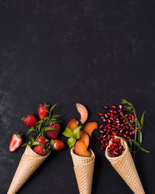 Free Photo copy-space ice cream cones with fruits