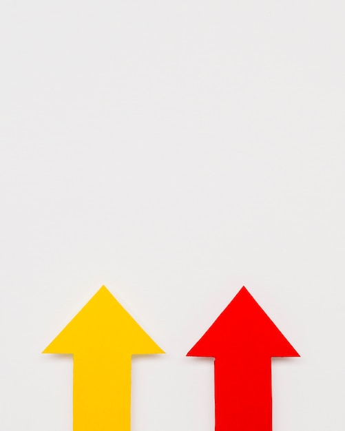 Free photo copy-space red and yellow arrow sign