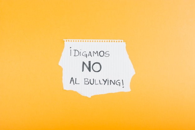 Copybook sheet with Spanish slogan against bullying 