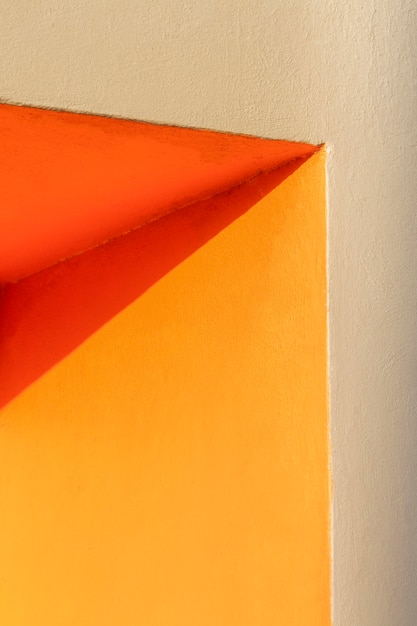 Free photo corner of an orange wall and shadow