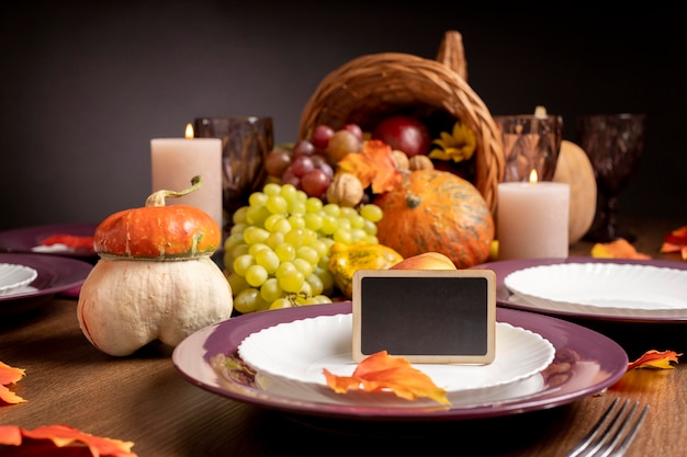 Free photo cornucopia arrangement with delicious foods and empty blackboard