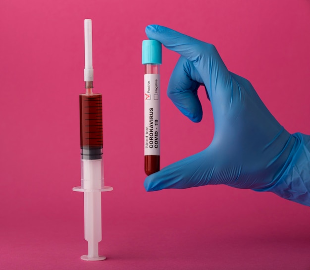 Coronavirus vaccine assortment on pink