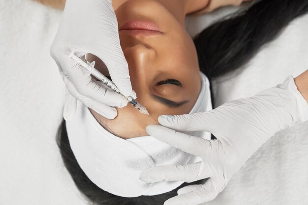 Cosmetic botox injection in female forehead