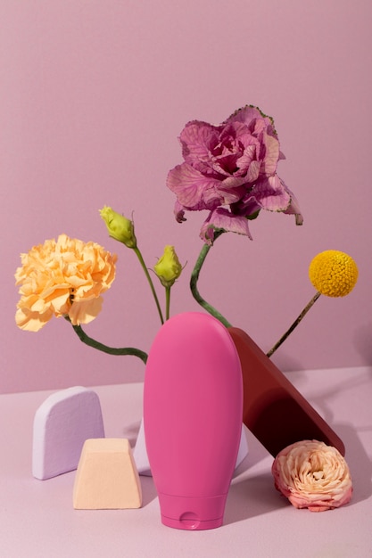 Free photo cosmetics and flowers still life