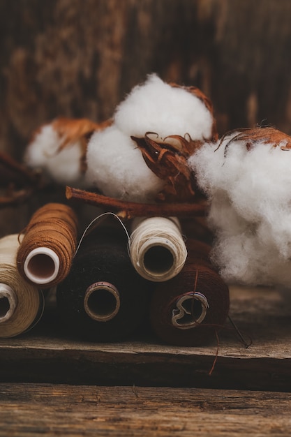 Cotton flowers on wooden table