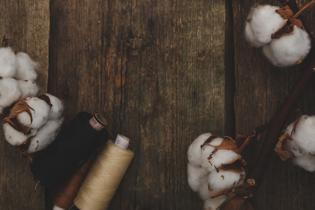 Cotton flowers on wooden table