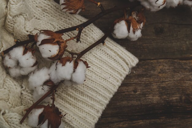 Cotton flowers on wooden tables on wooden table