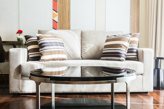 Couch with cushions and glass table