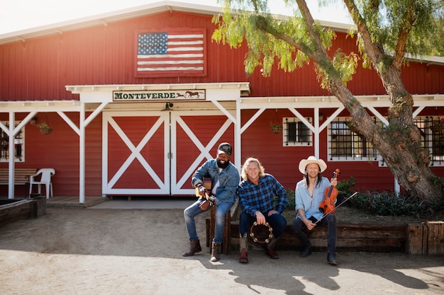 Free photo country music band singing outdoors