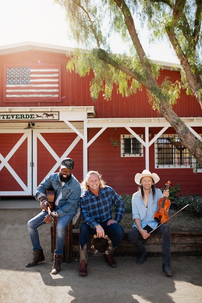 Free photo country music band singing outdoors