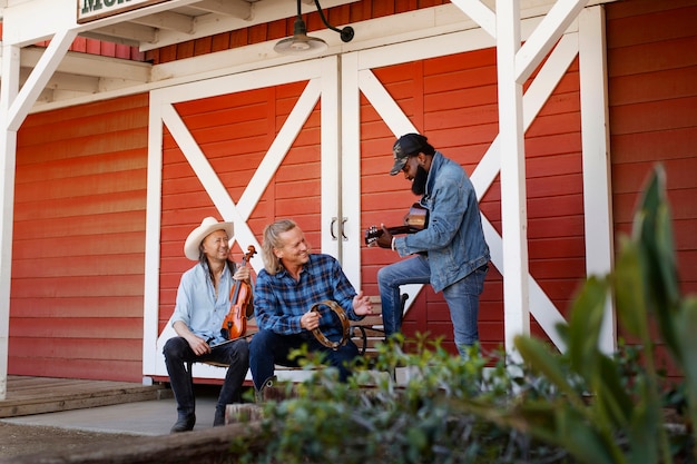 Free photo country music band singing outdoors