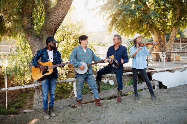 Free photo country music band singing outdoors