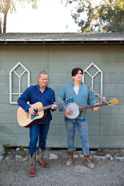 Free photo country music band singing outdoors