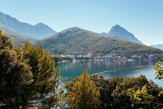 Countryside houses near the idyllic lake near the mountains