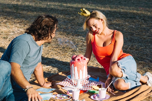 Couple celebrating birthday on picnic