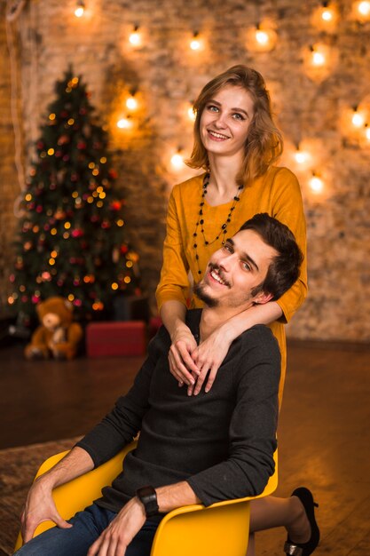 Couple celebrating christmas together in living room