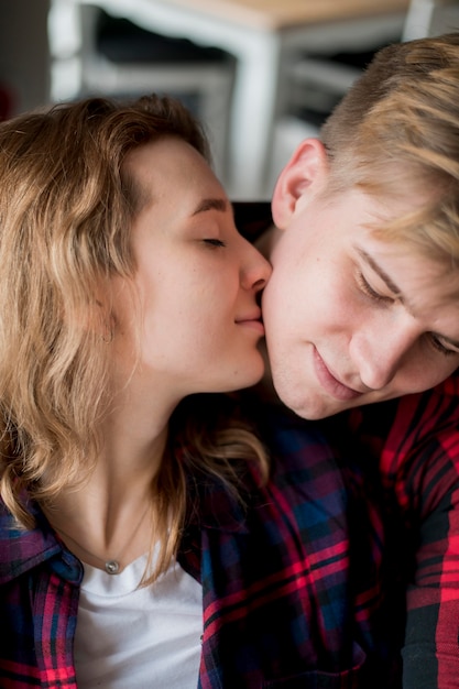 Couple cheek kiss