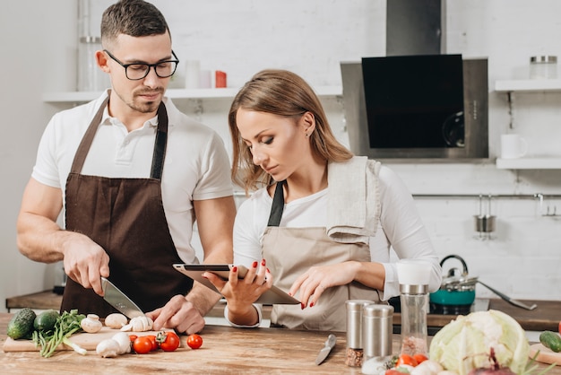 Free photo couple cooking at home