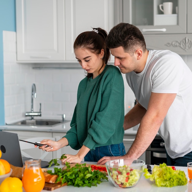 Couple cooking at home