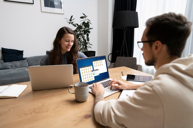 Couple at desk working together from home