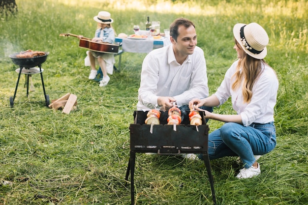 Couple doing a barbecue in nature