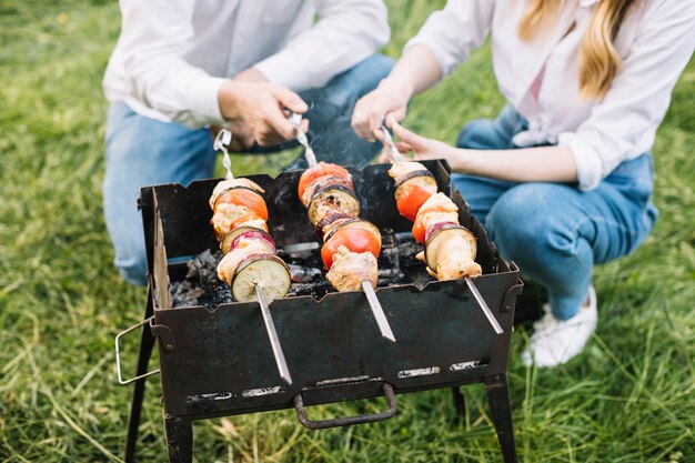 Couple doing a barbecue in nature