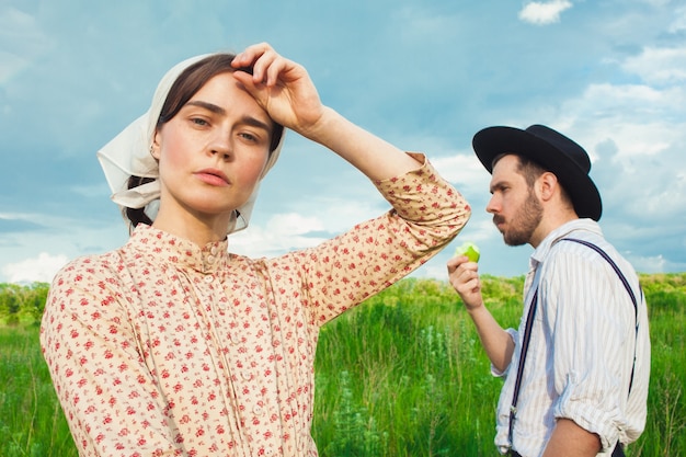 couple doing a picnic in the meadow