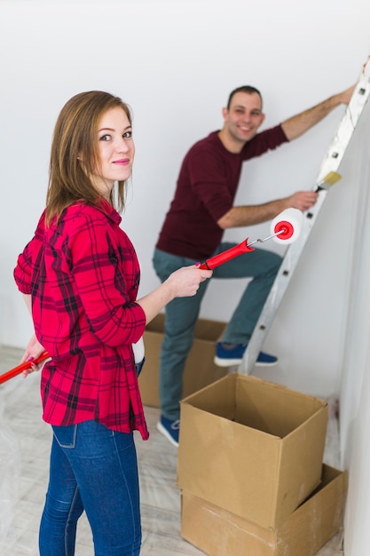 Free Photo couple doing renovation and looking at camera