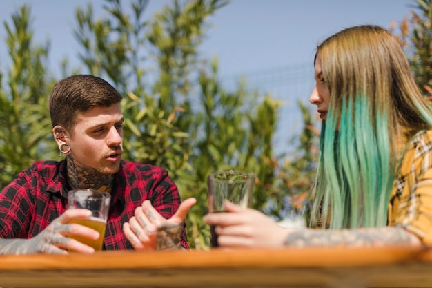 Couple drinking craft beer outdoors