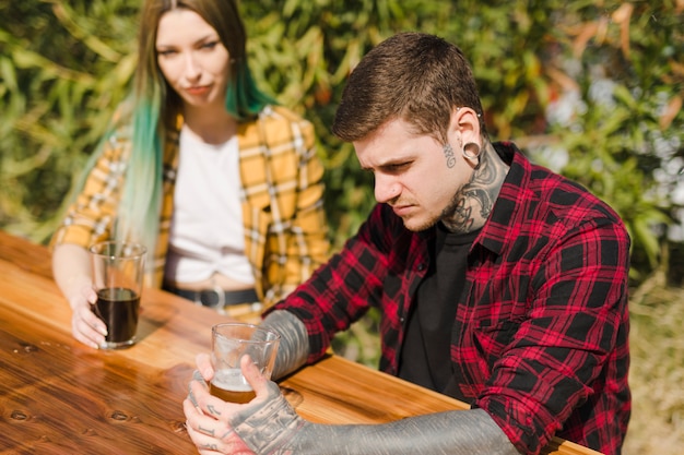 Couple drinking craft beer outdoors