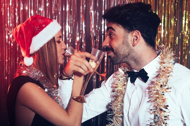 Couple drinking at new year party