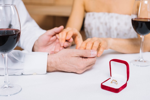 Free photo couple during dinner with engagement ring