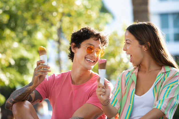 Couple eating ice cream while traveling