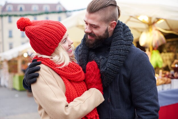 Couple embracing on christmas market