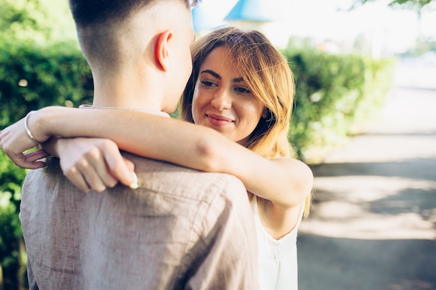 Free Photo couple embracing in park