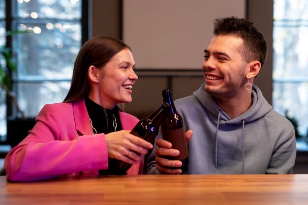 Couple enjoying a bottle of beer