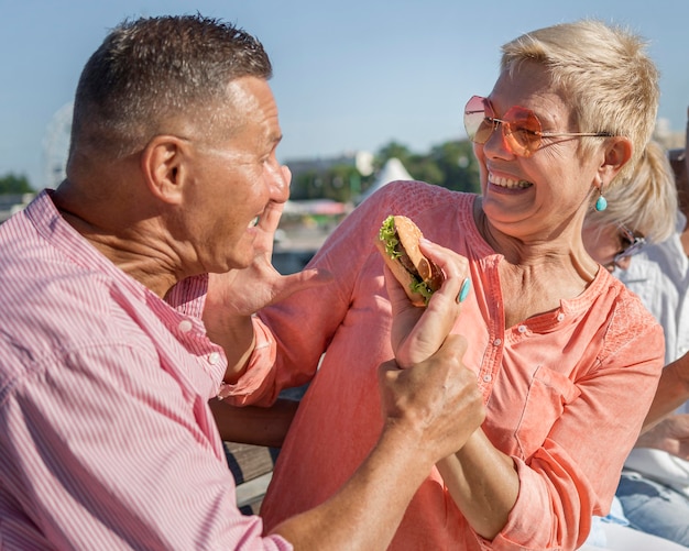 Couple enjoying a burger outdoors