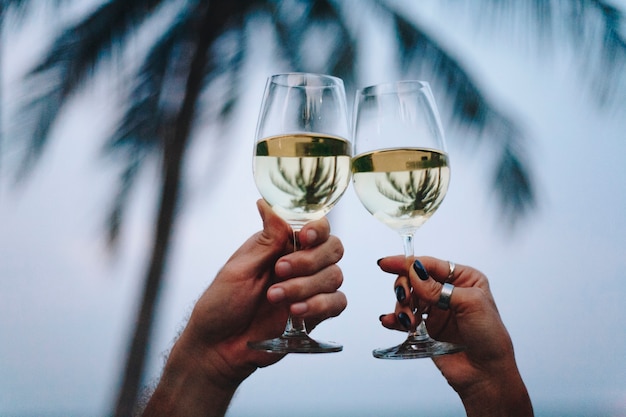 Couple enjoying a glass of wine by the beach